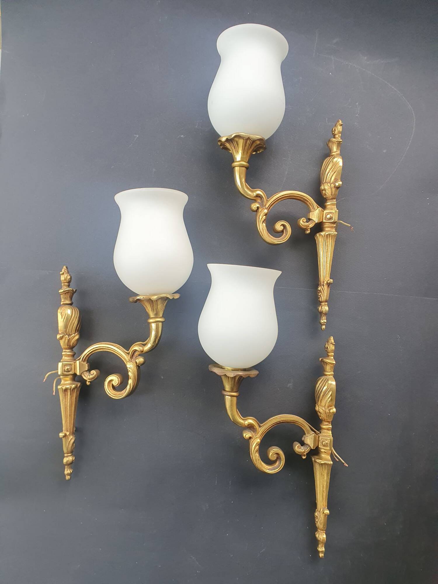 Three large vintage torch wall sconces.