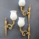 Three large vintage torch wall sconces.
