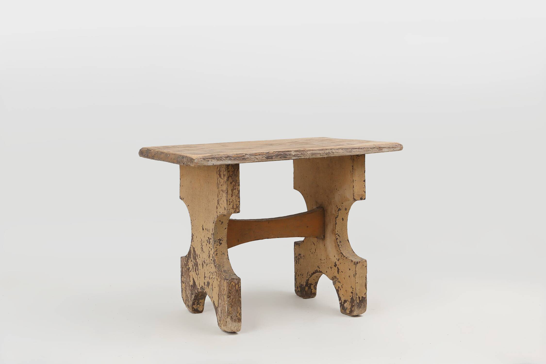 Beautiful shaped rustig low stool in painted wood, France ca. 1900