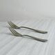 Pair of metal forks, ornate design