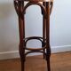 high curved wooden stool of Thonet type, in new condition
