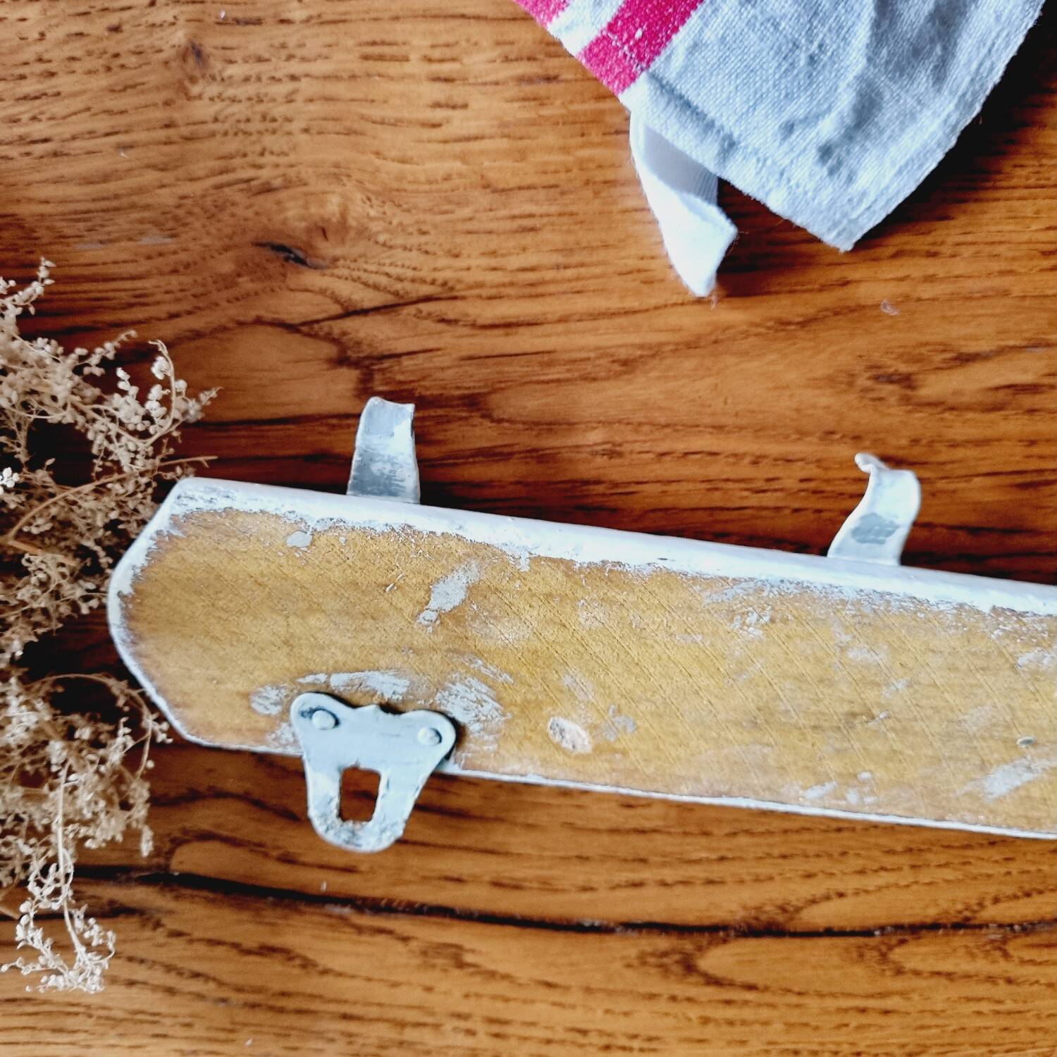 Old coat hook tea towel holder
