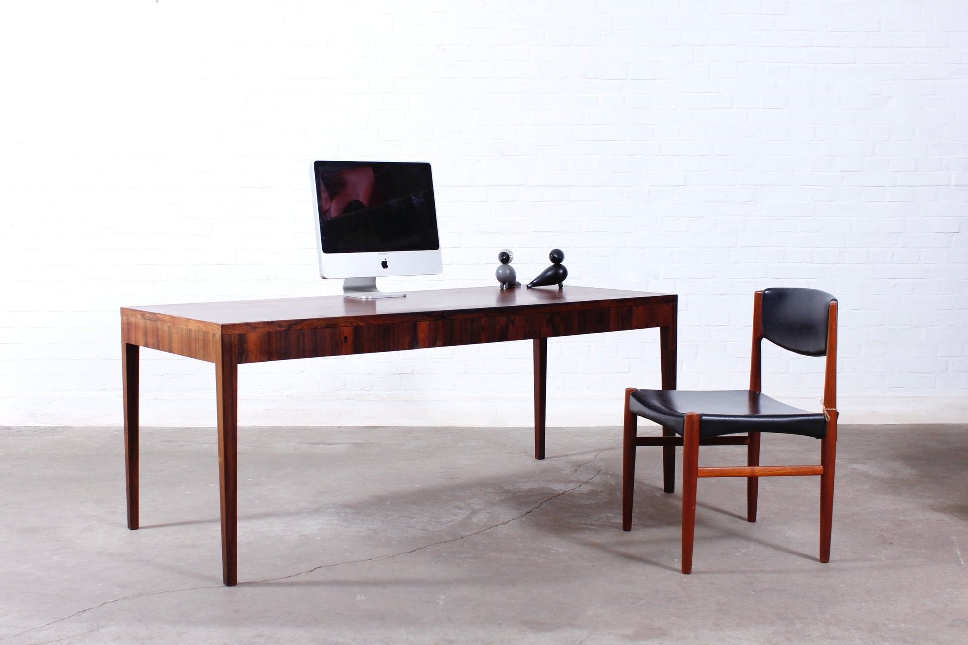 Minimalist rosewood desk by Riis Andersen