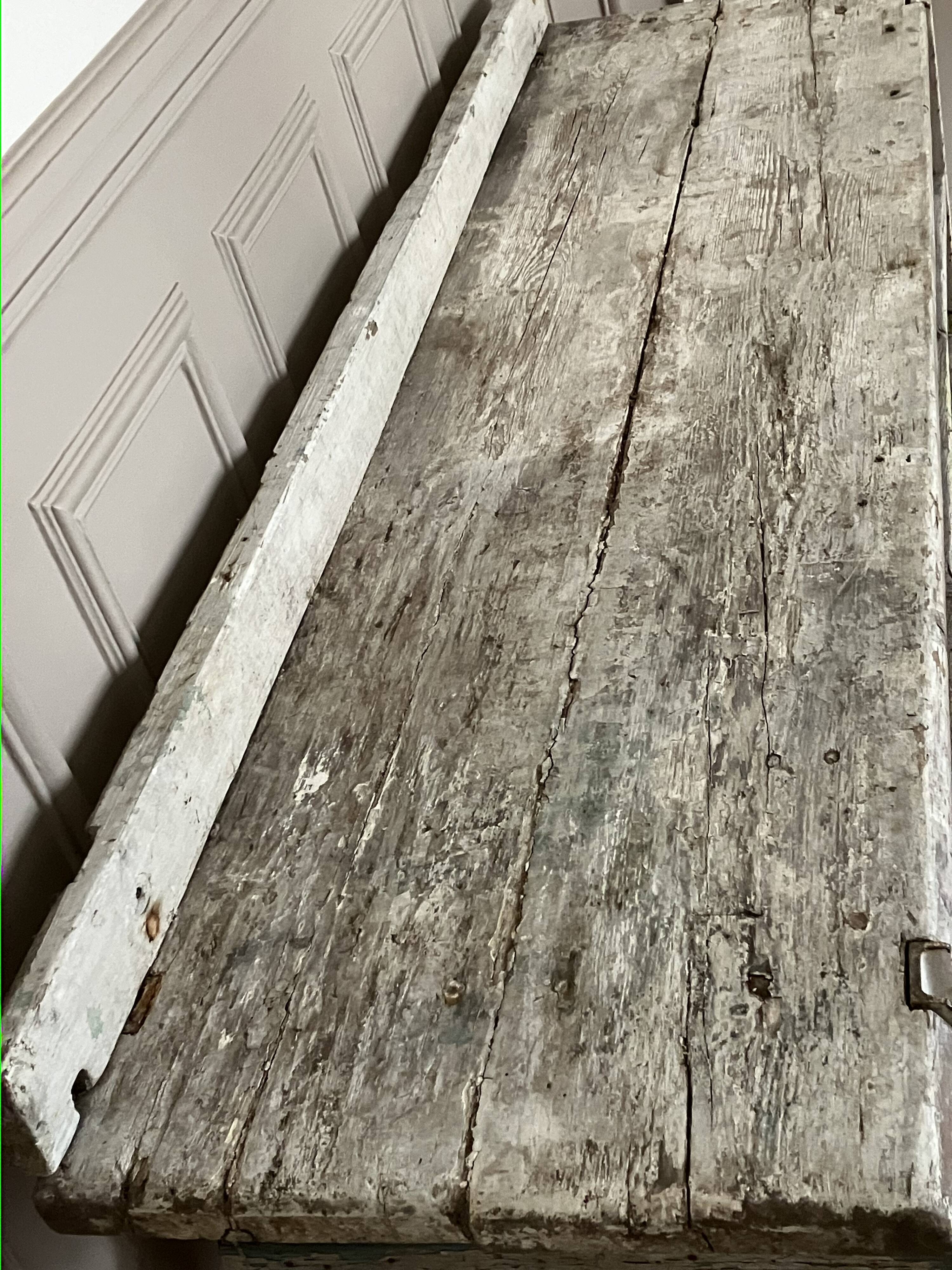Old workbench, a piece of wooden and metal furniture.