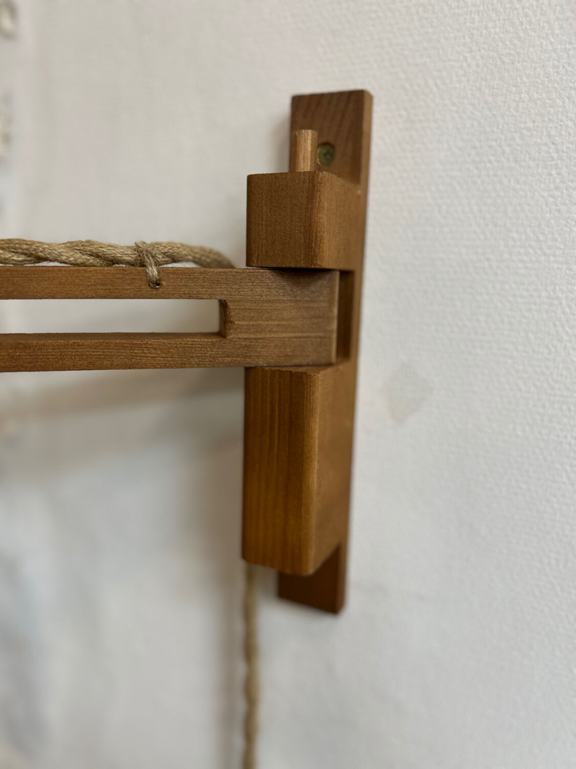 Two portable lamps with wall mount.