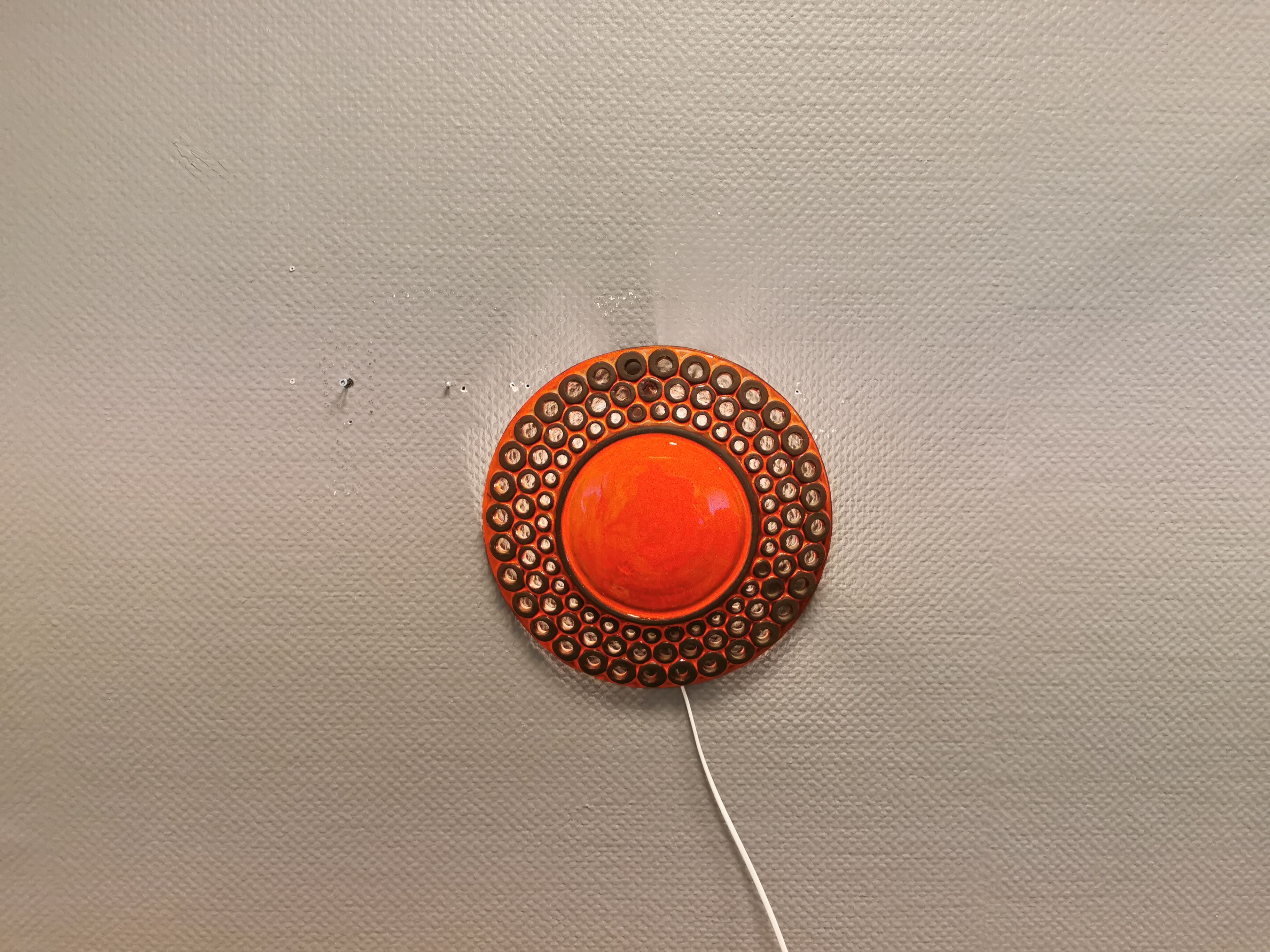 Wall light made from brown and red ceramic. Signed Norman Motala Sweden 1970s.