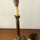 Ancient lamp foot candlestick corinthian column in bronze