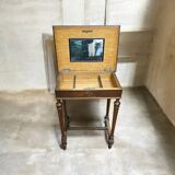 Antique wooden work table, inlaid top and interior mirror.