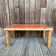 Modernist pine and orange lacquered coffee table, 1970s