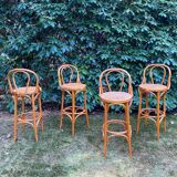 Set of four cane and webbing bar stools