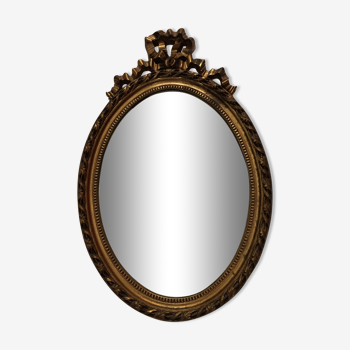 Miroir ovale en bois doré 52 x 35 cm