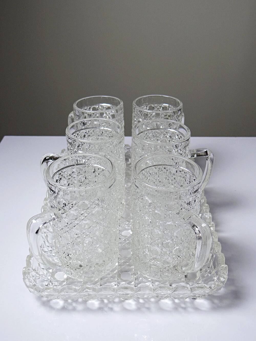 6 small vintage/antique pressed glass mugs and tray, art deco style