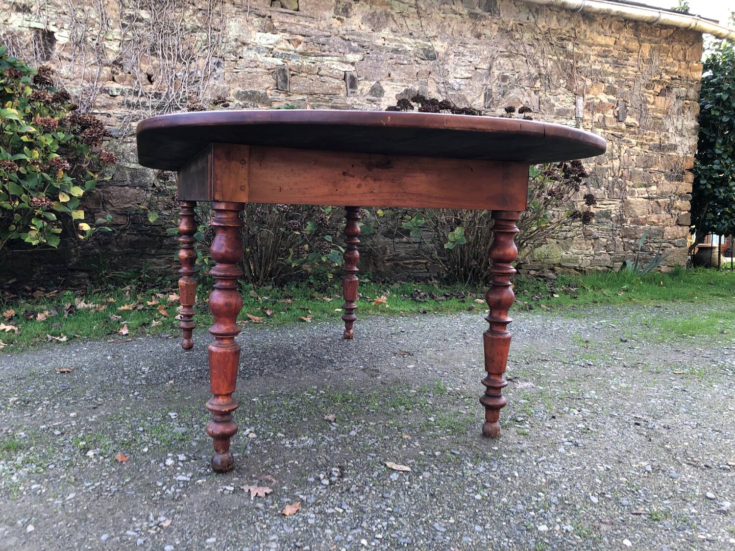 Antique cherry wood farmhouse table with rounded ends