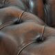Brown Chesterfield armchair made of cowhide leather in English style