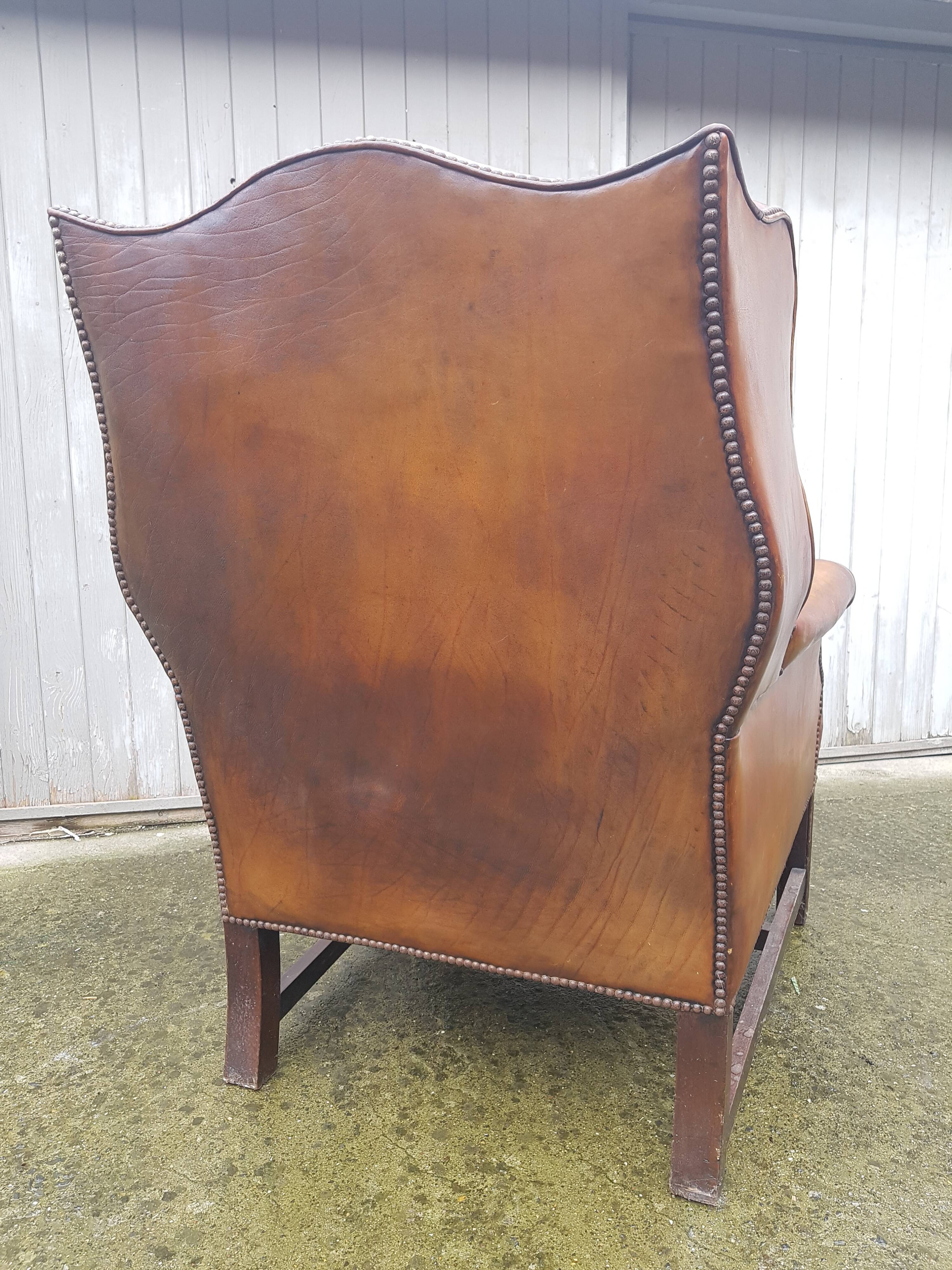 English fawn leather armchair with ears Chesterfield club
