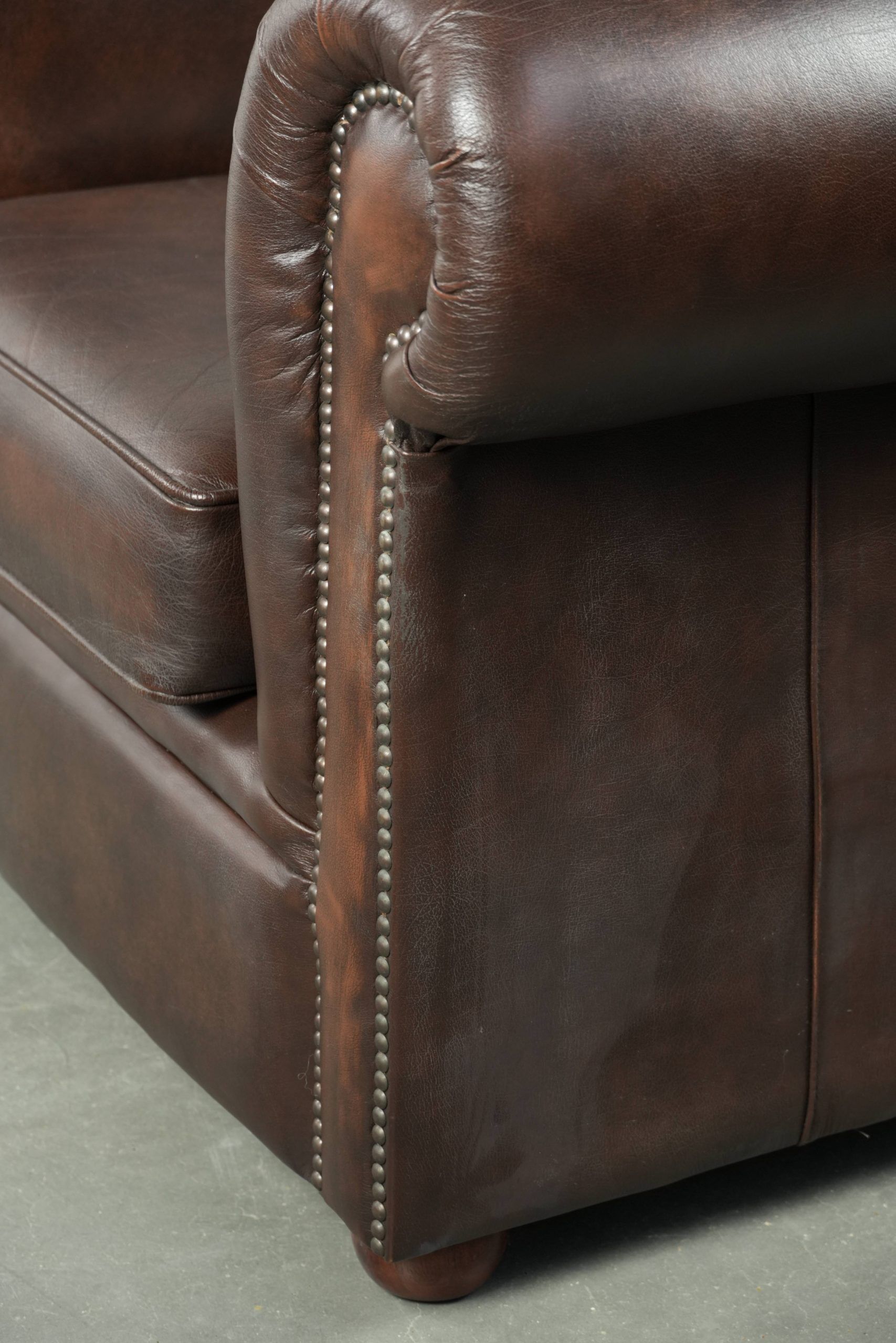 Luxury brown cow leather Chesterfield armchair with a timeless English look