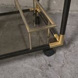 Black metal and brass rolling dessert trolley, smoked glass, 1970s.