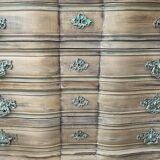 Patinated baroque crossbow chest of drawers