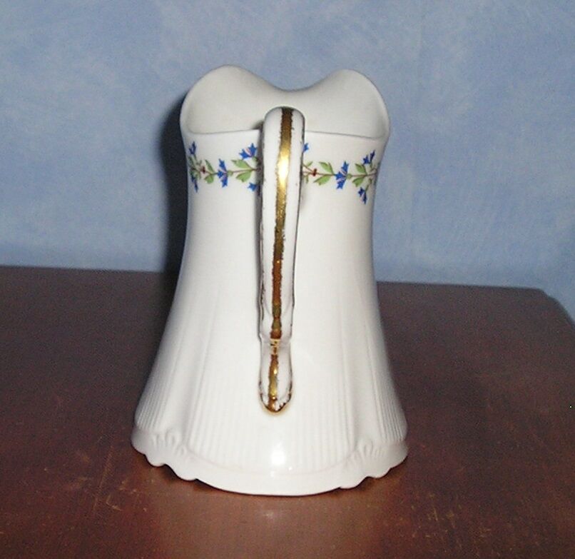 Pitcher in Limoges porcelain, barbel decoration