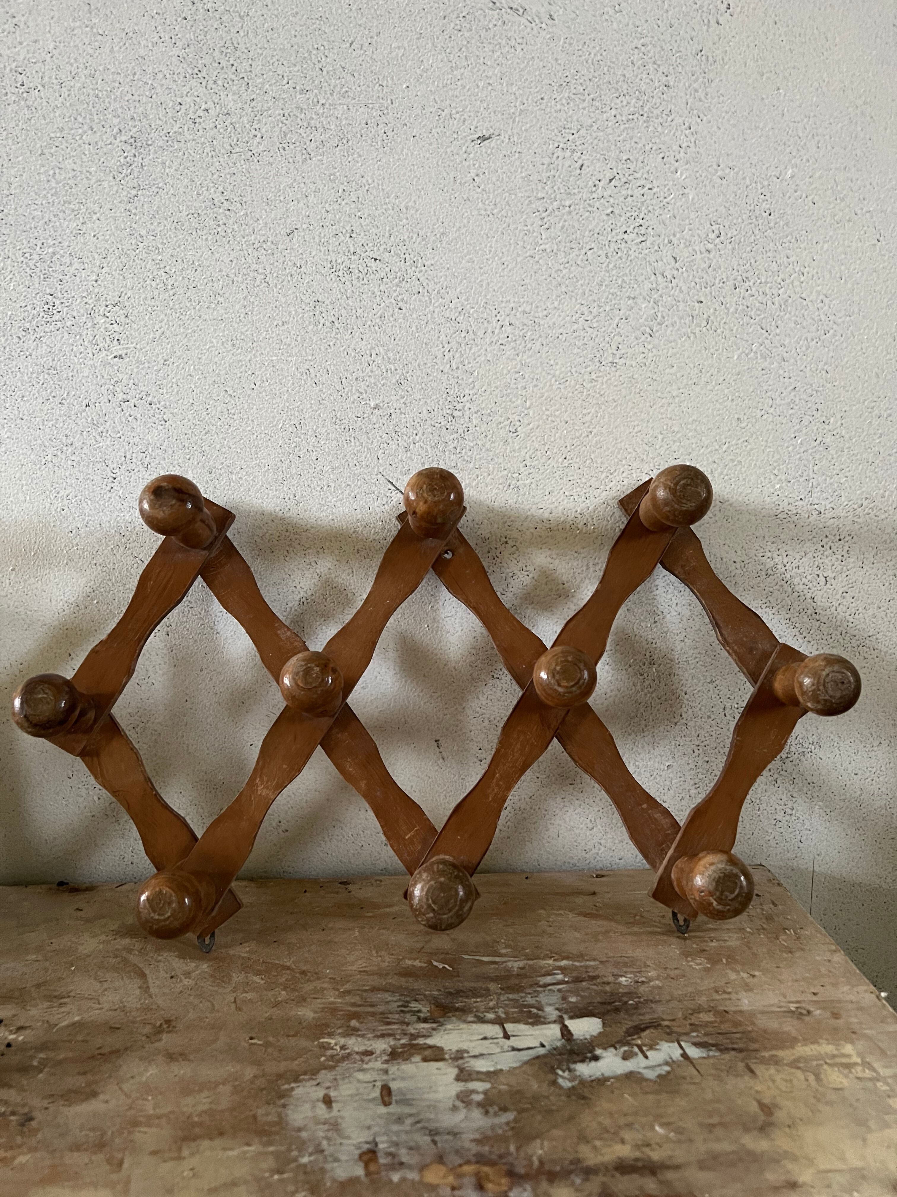 Wooden accordion wall coat rack