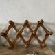 Wooden accordion wall coat rack