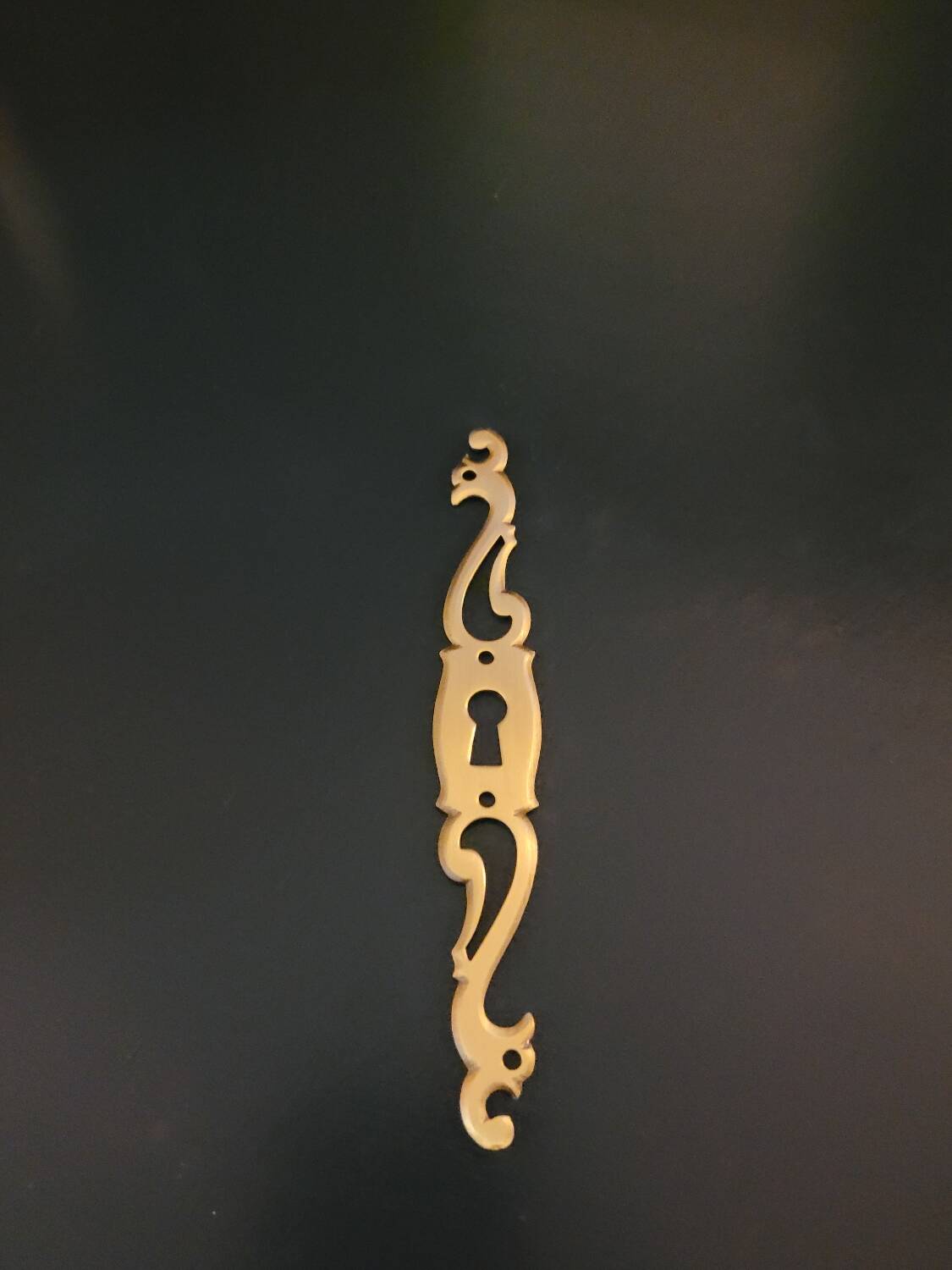 Patinated brass key entries