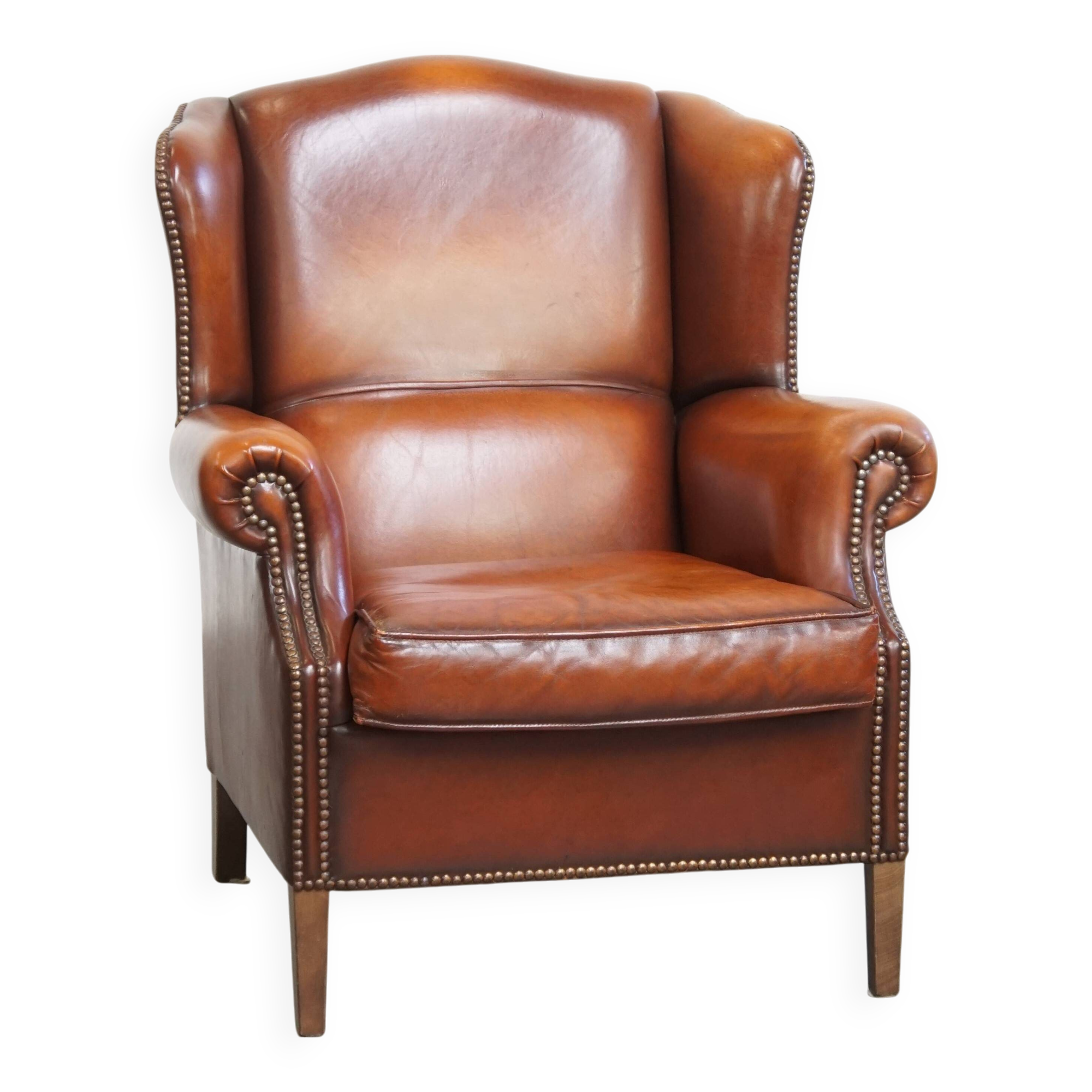 Fauteuil à oreilles en cuir de mouton
