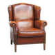 Fauteuil à oreilles en cuir de mouton