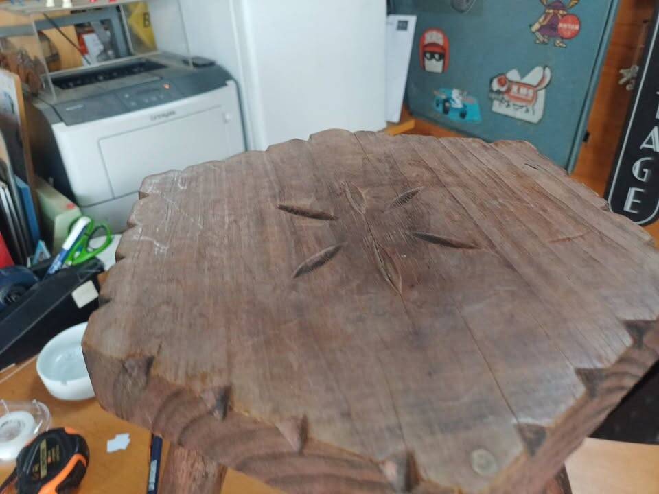Vintage tripod stool in carved solid wood.