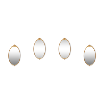 ensemble de 4 miroirs muraux classiques en laiton en forme de médaillon des années 1970