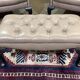 Pair of high-backed Chesterfield armchairs with 1 leather footrest