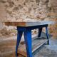 Vintage industrial workbench table with cast iron legs (Aux Forges de Vulcain)