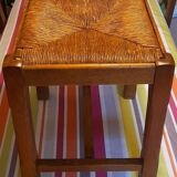 Oak stool seated in straw