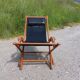 Old deckchair deck chair in wood and black leather - 40s