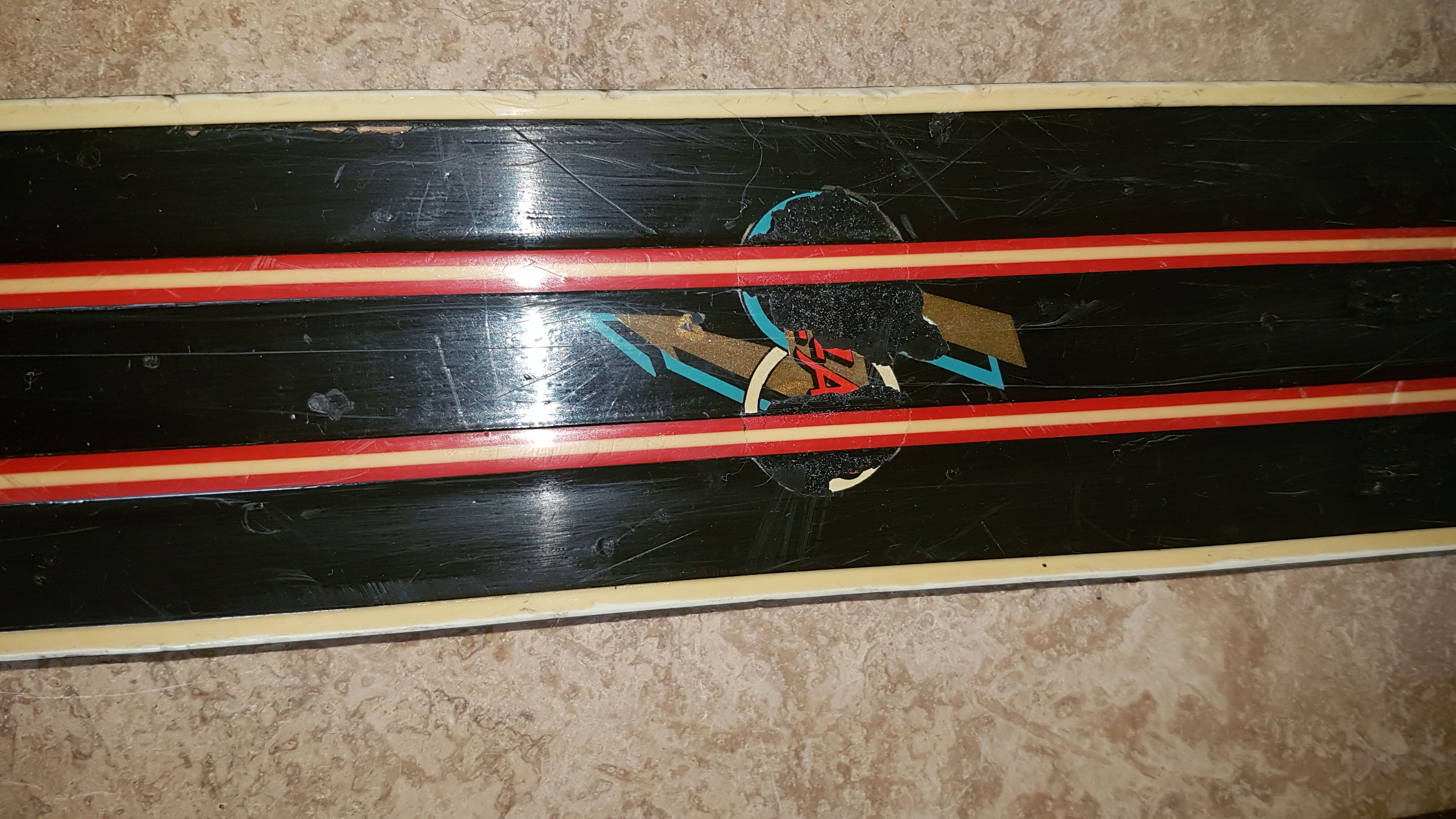 Old skis wooden and its pair of sticks