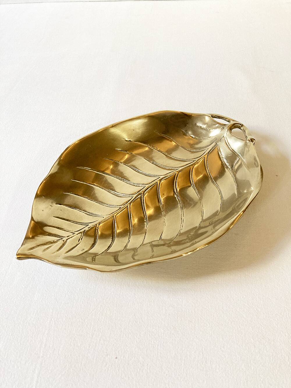 Brass pocket emptier