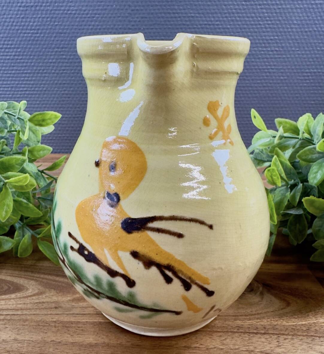 Earthenware pitcher from Savoy with bird decoration.