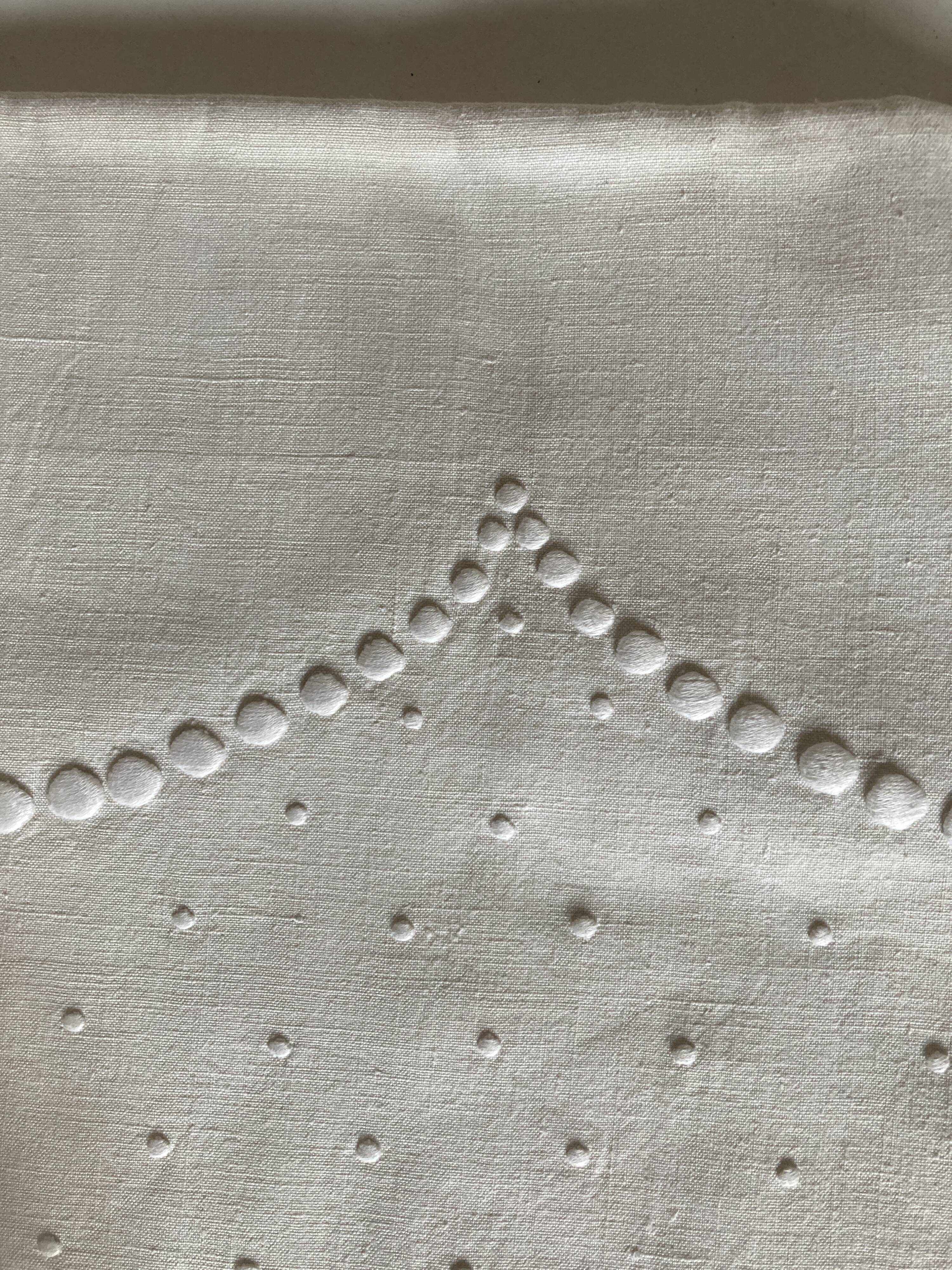 Linen cloth sheet embroidered with a pea festoon