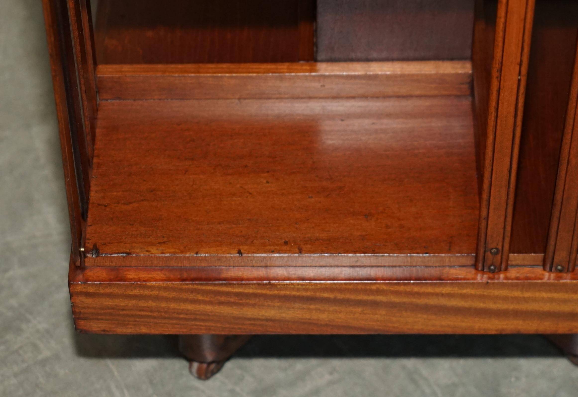 Sheraton-style rotating library table in walnut and satinwood.