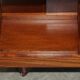 Sheraton-style rotating library table in walnut and satinwood.