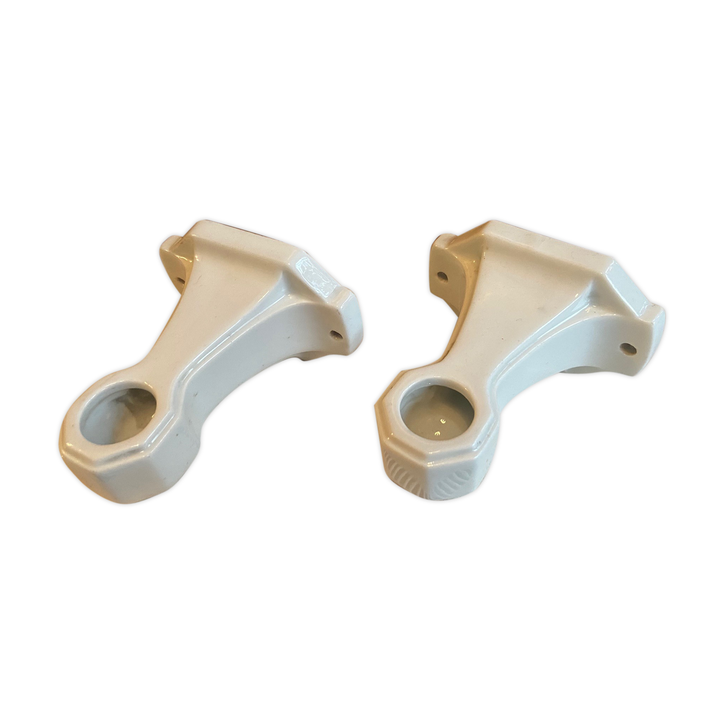 Pair of white earthenware wall candlesticks