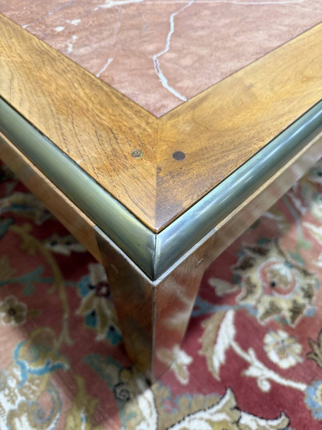 Contemporary coffee table in mahogany and marble.