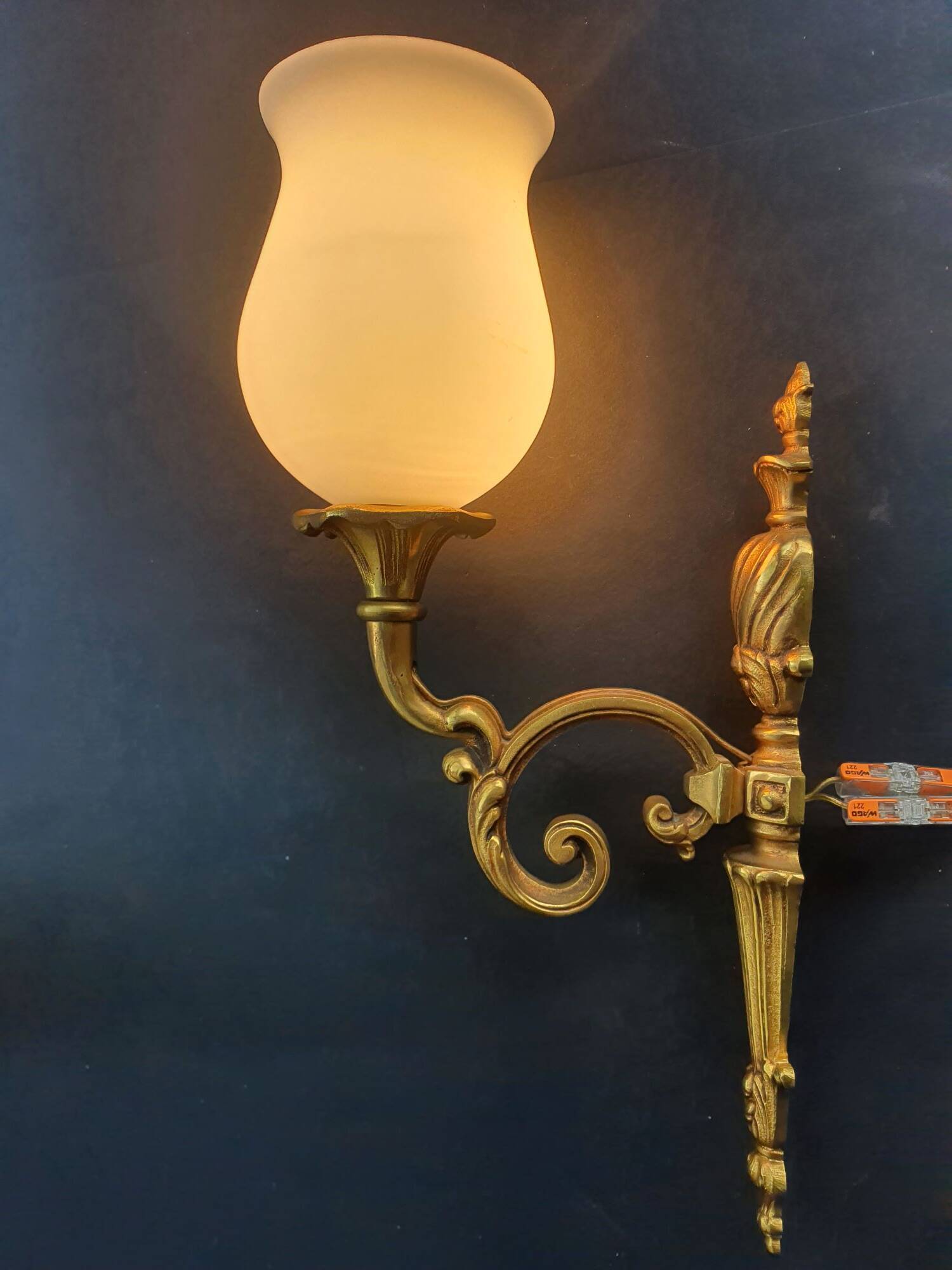 Three large vintage torch wall sconces.