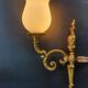 Three large vintage torch wall sconces.