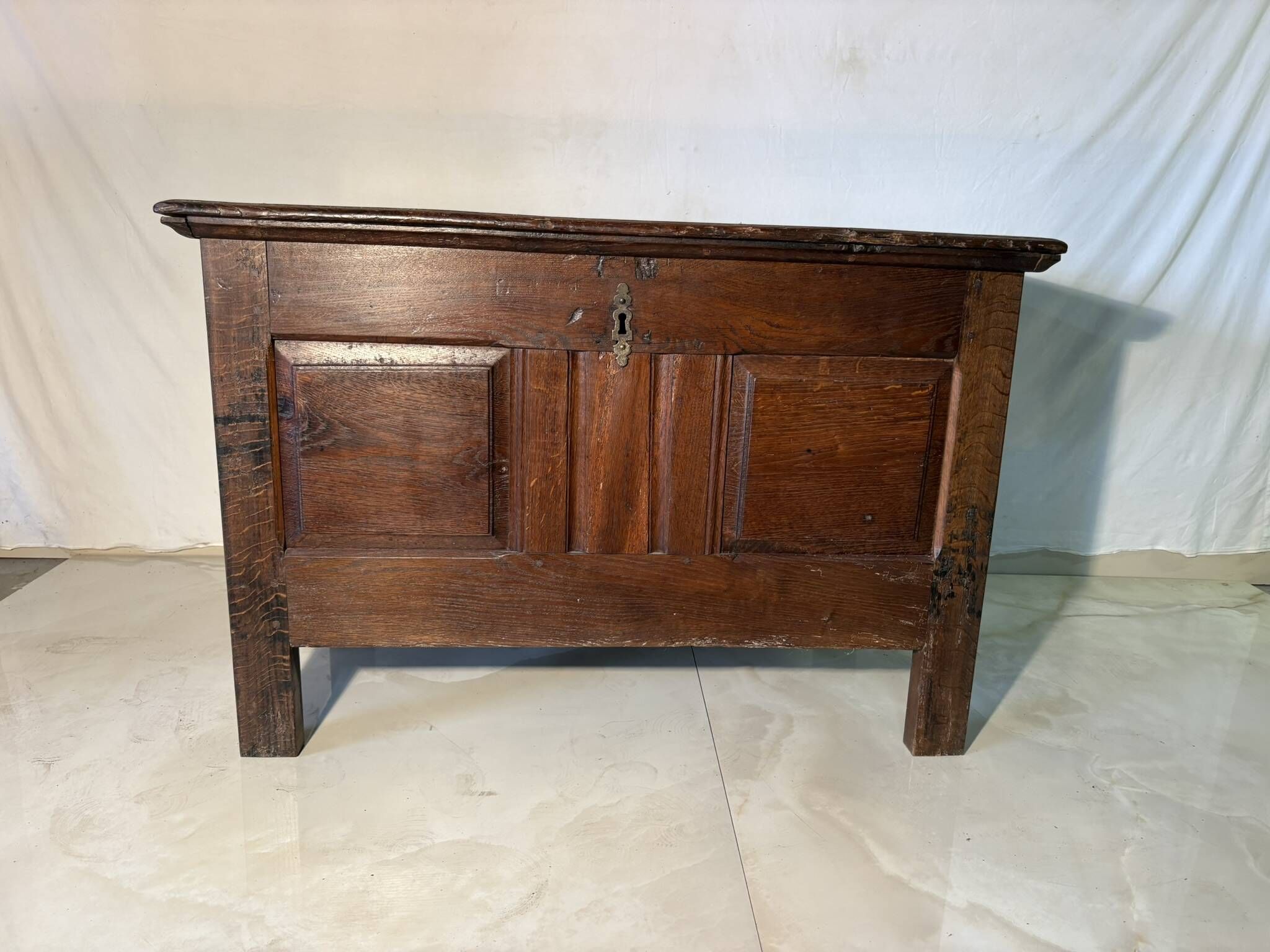 Rustic antique oak chest, original fittings and moulded panels.