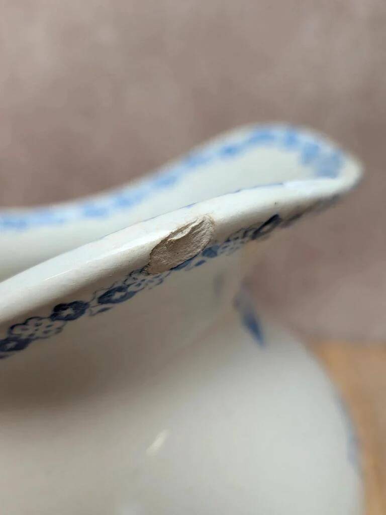 Small antique ironstone jug L.m Creil and Montereau with blue floral decoration.