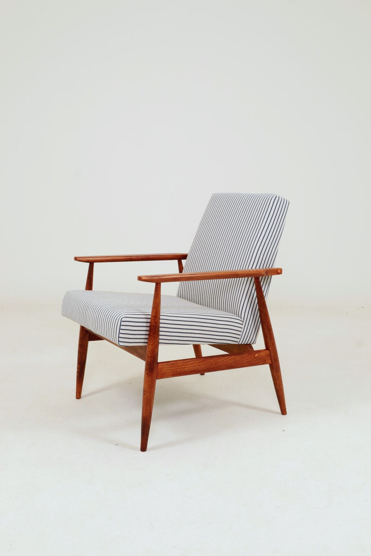 Armchair with striped fabric footrest, 1960