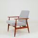 Armchair with striped fabric footrest, 1960