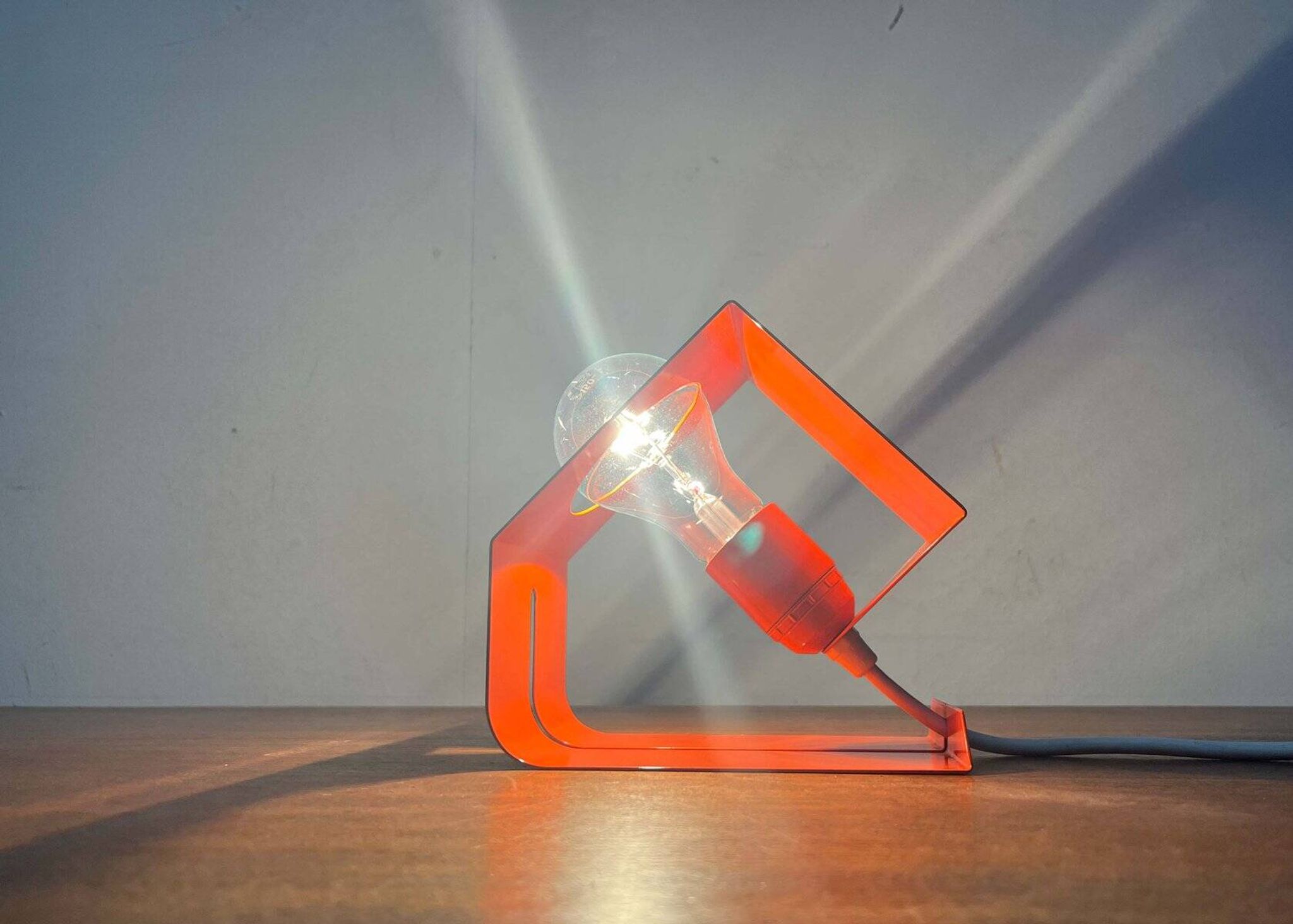 Orange metal table lamp, minimalist, modern mid-century space age, 1960s.