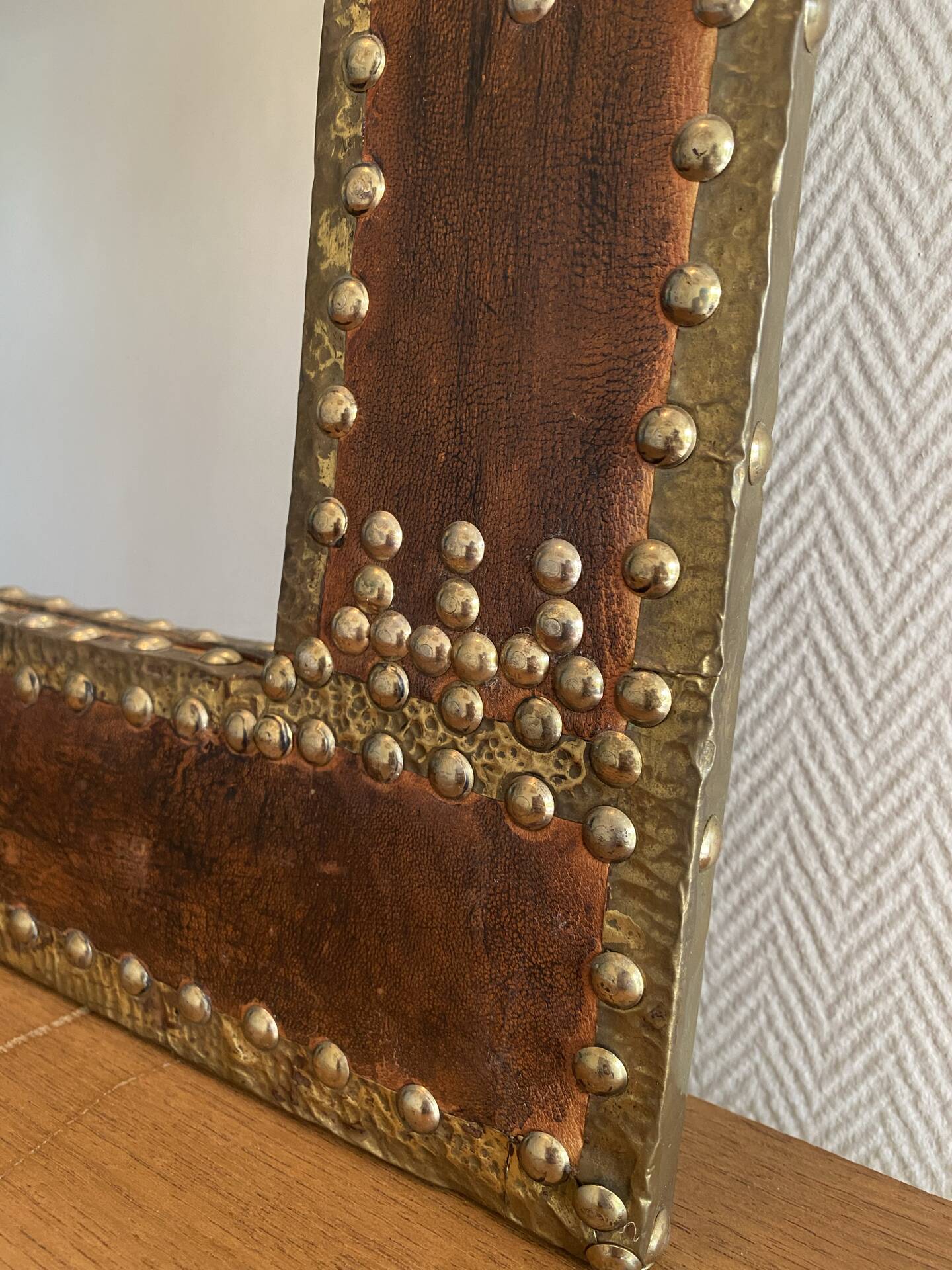 Large vintage mirror in studded leather and brass